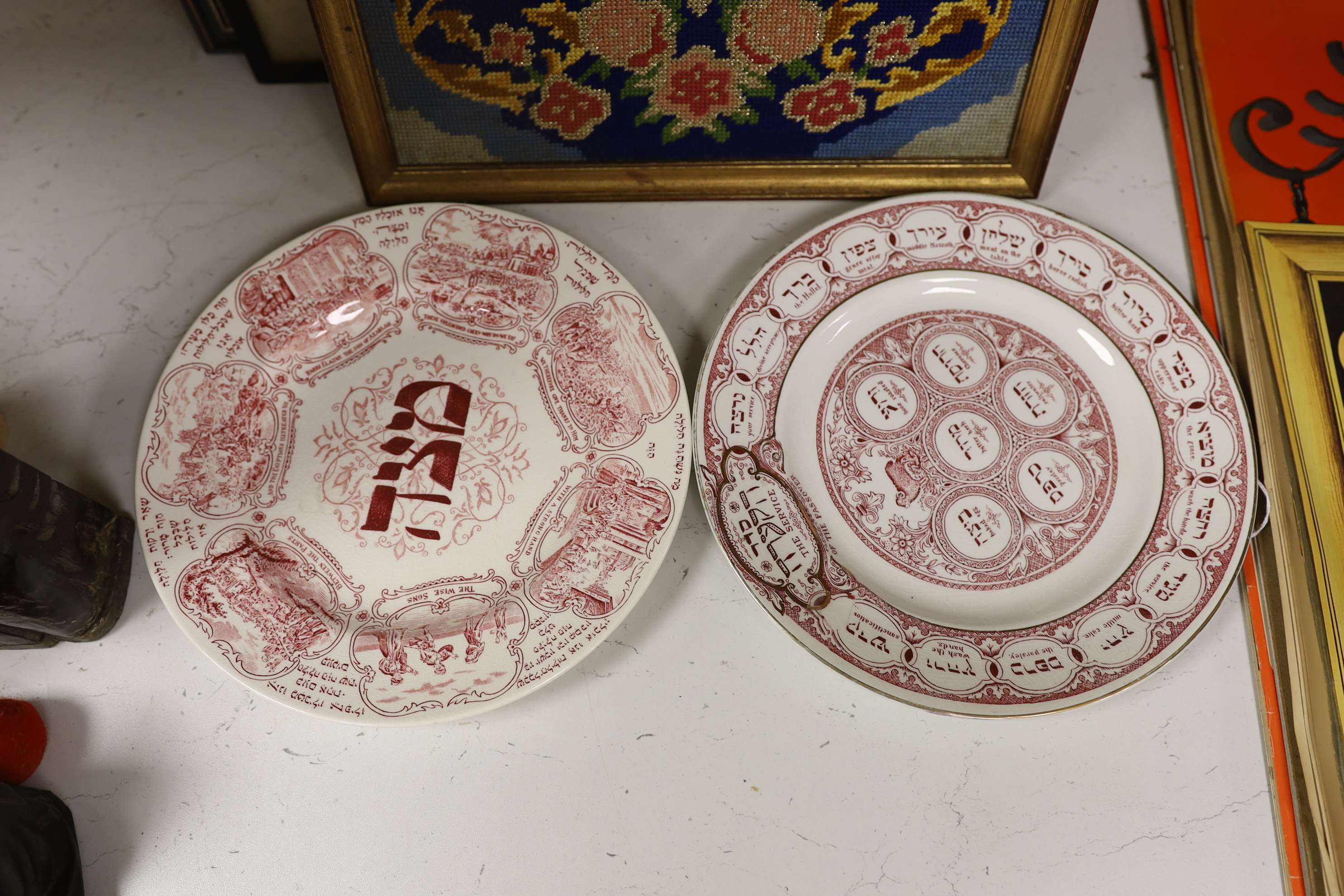 Judaica - two 1920's Ridgways pottery Passover plates, a needlepoint picture and two prints